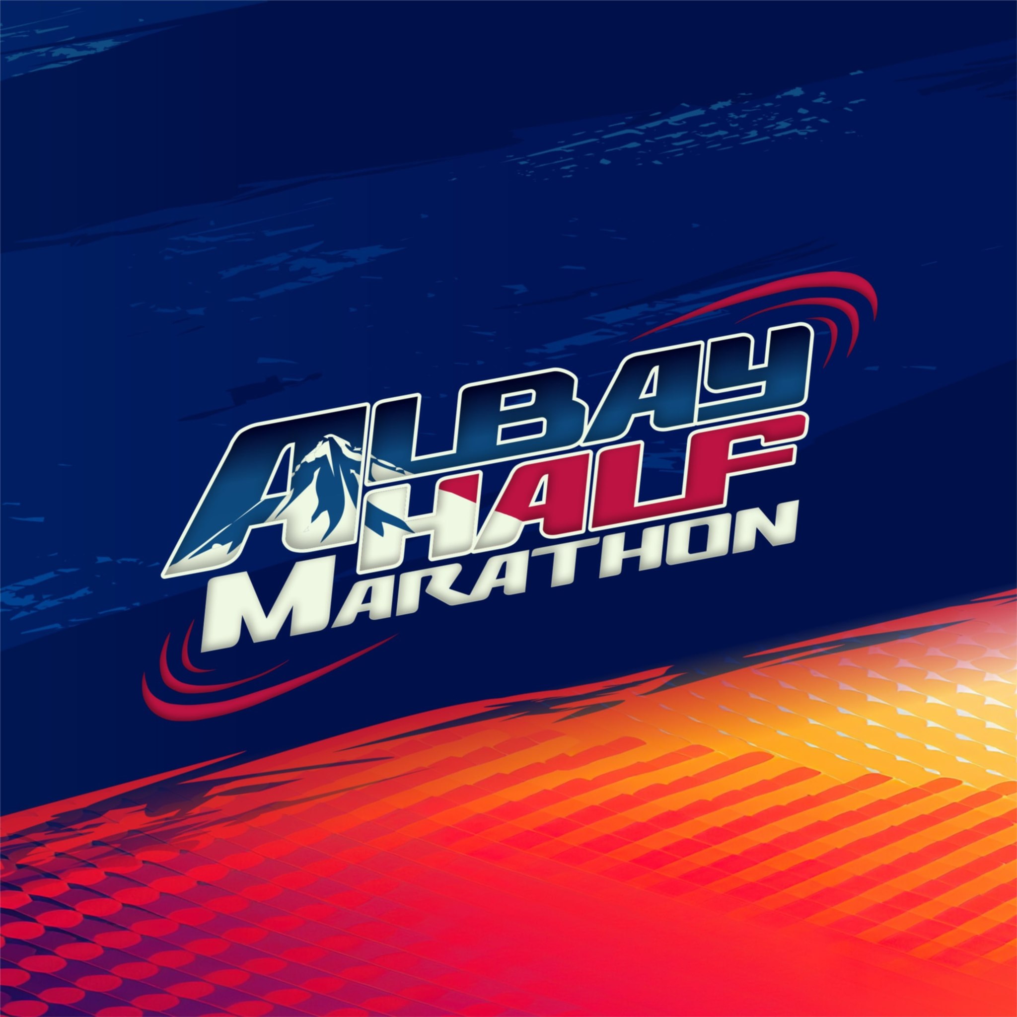 Brown leather key ring with brass metal loops and rivets on wood table.