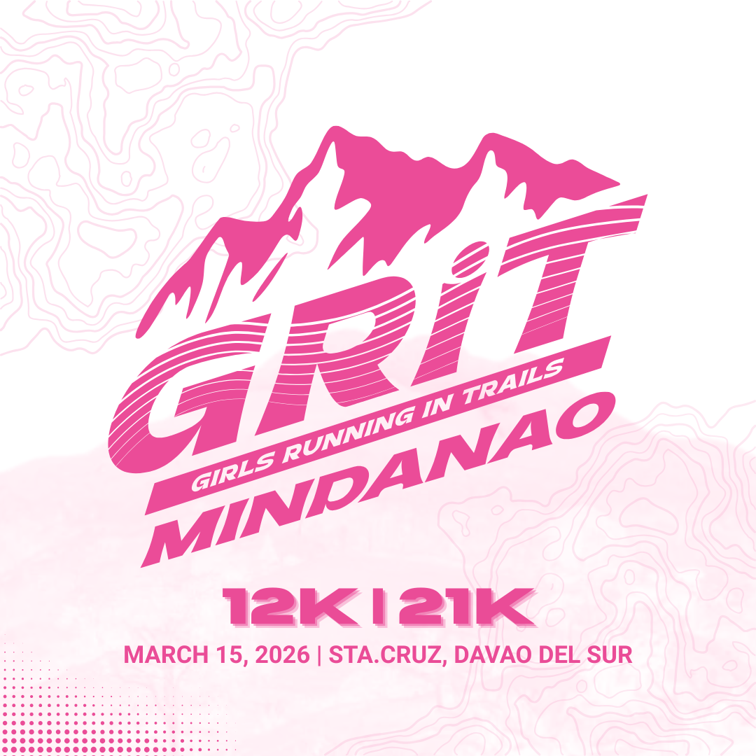 Brown leather key ring with brass metal loops and rivets on wood table.